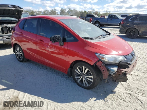 2015 Honda Fit EX-L with VIN 3HGGK5H83FM771673, listed as a Copart auction lot 76297004 with 186,736 mi miles and Salvage Title. Bid and sale history available at DreamBid. Image 4.