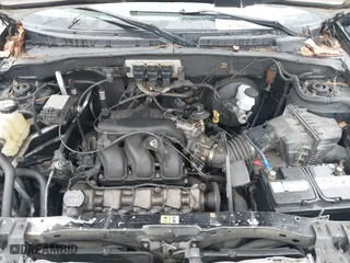 2005 Ford Escape XLT with VIN 1FMYU03155KD75479, listed as a IAAI auction lot 41757864 with 213,571 mi miles. Bid and sale history available at carsss.com. Image 10.