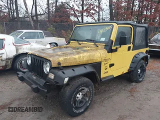 2000 Jeep Wrangler Sport with VIN 1J4FA49S4YP763414, listed as a IAAI auction lot 41478005 with 222,012 mi miles. Bid and sale history available at carsss.com. Image 2.
