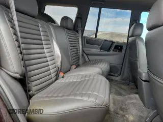 1994 Jeep Grand Cherokee Laredo z VIN 1J4GZ58S0RC221854, wystawiony jako Copart lot #61950825 z przebiegiem 69 465 mil mil oraz Czysty tytuł • Clean title. Historia ofert i sprzedaży dostępna na DreamBid. Obrazek 11.