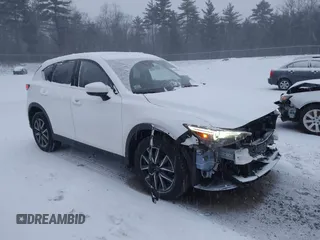2018 Mazda CX-5 Grand Touring with VIN JM3KFBDM8J0314777, listed as a IAAI auction lot 41130229 with 65,391 mi miles. Bid and sale history available at carsss.com. Image 1.