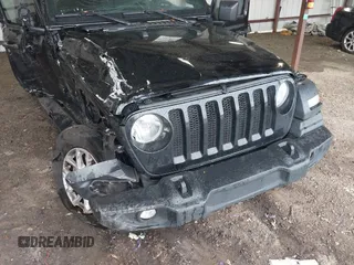 2023 Jeep Wrangler Willys with VIN 1C4HJXDG0PW617101, listed as a IAAI auction lot 42111687 with 56,415 mi miles and . Bid and sale history available at DreamBid. Image 6.