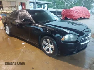 2014 Dodge Charger SE with VIN 2C3CDXBG8EH240828, listed as a IAAI auction lot 42158404 with 211,686 mi miles and . Bid and sale history available at DreamBid. Image 1.