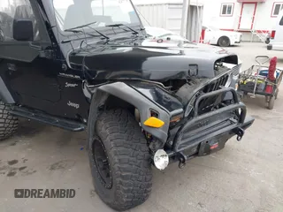 2002 Jeep Wrangler Sport with VIN 1J4FA49S02P705470, listed as a IAAI auction lot 42477770 with 59,395 mi miles and . Bid and sale history available at DreamBid. Image 6.
