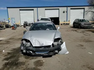2006 Hyundai Tiburon GT z VIN KMHHN65F76U190851, wystawiony jako Copart lot #45935795 z przebiegiem 102 335 mil mil oraz Szkoda całkowita • Salvage title. Historia ofert i sprzedaży dostępna na DreamBid. Obrazek 11.