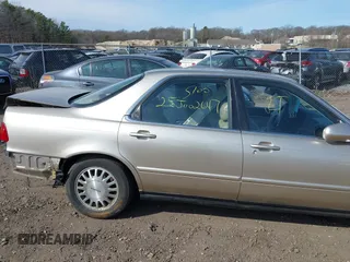 1995 Acura Legend L w/Cloth with VIN JH4KA7668SC012813, listed as a IAAI auction lot 41789026 with 242,265 mi miles. Bid and sale history available at carsss.com. Image 6.