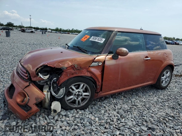 2011 MINI Hardtop with VIN WMWSU3C52BT094399, listed as a Copart auction lot 56561635 with 94,428 mi miles and Salvage Title. Bid and sale history available at DreamBid. Image 1.