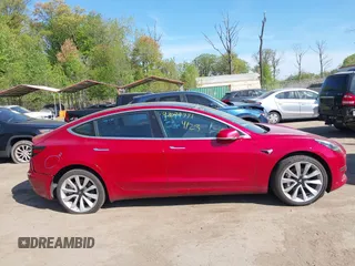 2018 Tesla Model 3 Long Range Battery z VIN 5YJ3E1EA3JF047287, wystawiony jako IAAI lot #42099771 z przebiegiem 120 470 mil mil oraz . Historia ofert i sprzedaży dostępna na DreamBid. Obrazek 12.
