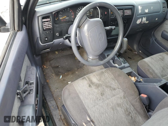 1999 Toyota Tacoma PreRunner z VIN 4TASM92N5XZ417982, wystawiony jako Copart lot #85216054 z przebiegiem 200 772 mil mil oraz Szkoda całkowita • Salvage title. Historia ofert i sprzedaży dostępna na DreamBid. Obrazek 8.