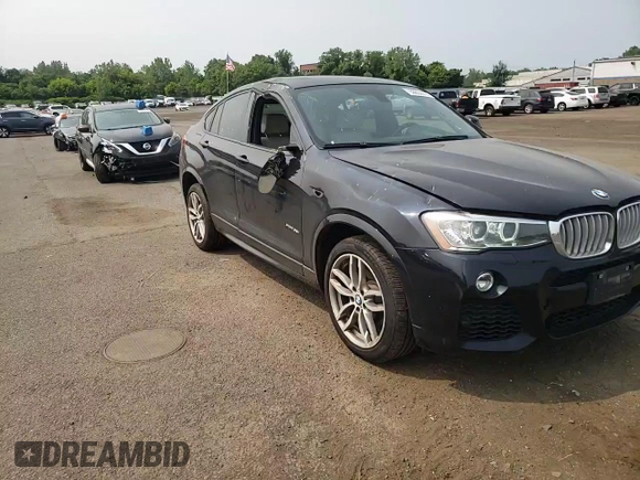 2015 BMW X4 xDrive35i with VIN 5UXXW5C59F0E87517, listed as a Copart auction lot 59604445 with 185,064 mi miles and Salvage title. Bid and sale history available at DreamBid. Image 14.