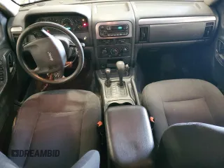 2004 Jeep Grand Cherokee Laredo with VIN 1J4GW48S94C432692, listed as a Copart auction lot 52506585 with 269,983 mi miles and Salvage Title. Bid and sale history available at carsss.com. Image 8.