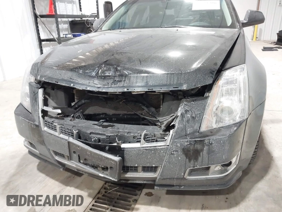 2013 Cadillac CTS Premium z VIN 1G6DS5E34D0103328, wystawiony jako IAAI lot #41501406 z przebiegiem 157 633 mil mil oraz . Historia ofert i sprzedaży dostępna na DreamBid. Obrazek 6.
