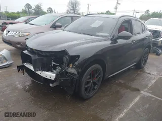 2021 Alfa Romeo Stelvio Ti with VIN ZASPAKBN9M7D09213, listed as a IAAI auction lot 41812289 with 38,410 mi miles. Bid and sale history available at carsss.com. Image 2.