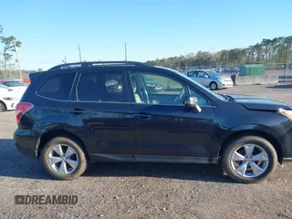 2014 Subaru Forester 2.5i Touring with VIN JF2SJAMC1EH452856, listed as a IAAI auction lot 41801406 with 148,342 mi miles. Bid and sale history available at carsss.com. Image 13.