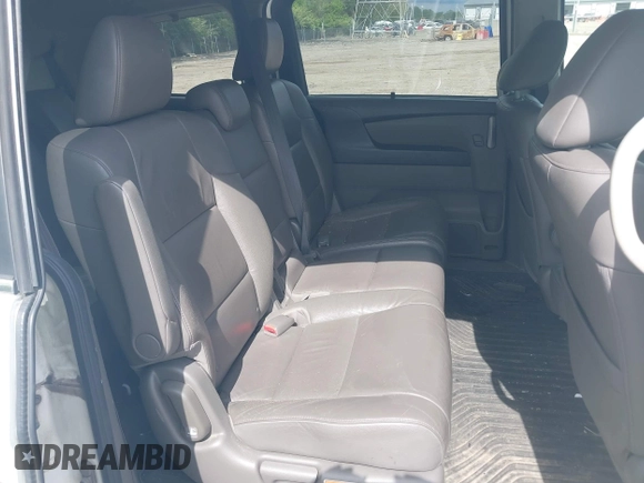 2012 Honda Odyssey EX-L with VIN 5FNRL5H63CB117341, listed as a IAAI auction lot 42197815 with 256,544 mi miles and . Bid and sale history available at DreamBid. Image 8.