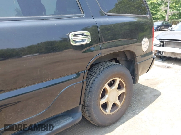 2002 GMC Yukon Denali z VIN 1GKEK63U82J189550, wystawiony jako IAAI lot #42416885 z przebiegiem 209 115 mil mil oraz . Historia ofert i sprzedaży dostępna na DreamBid. Obrazek 6.