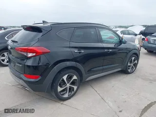 2017 Hyundai Tucson Value with VIN KM8J33A26HU362363, listed as a IAAI auction lot 41940376 with 127,986 mi miles. Bid and sale history available at carsss.com. Image 4.