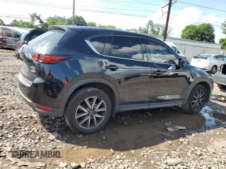 2018 Mazda CX-5 Grand Touring with VIN JM3KFBDM6J0345848, listed as a Copart auction lot 61587865 with 107,193 mi miles and Salvage title. Bid and sale history available at DreamBid. Image 3.