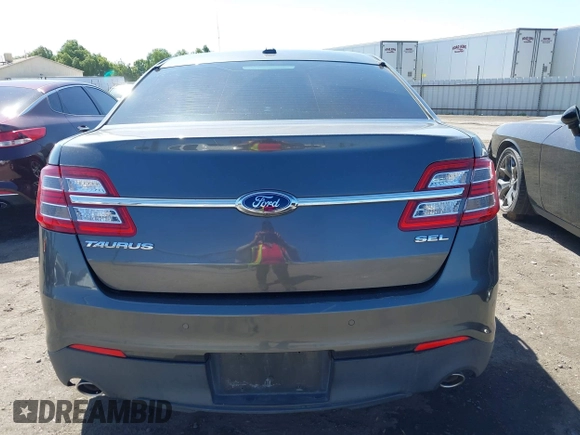 2015 Ford Taurus SEL z VIN 1FAHP2E83FG184588, wystawiony jako IAAI lot #42262166 z przebiegiem 116 392 mil mil oraz . Historia ofert i sprzedaży dostępna na DreamBid. Obrazek 16.