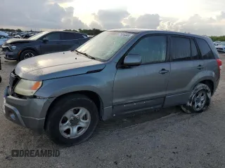 2010 Suzuki Grand Vitara Premium z VIN JS3TE0D21A4101120, wystawiony jako Copart lot #71016604 z przebiegiem 99 917 mil mil oraz Szkody całkowita. Historia ofert i sprzedaży dostępna na DreamBid. Obrazek 1.