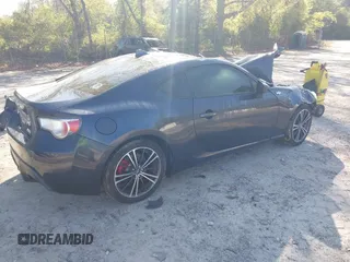 2015 Scion FR-S with VIN JF1ZNAA10F8707671, listed as a IAAI auction lot 42000130 with 136,734 mi miles. Bid and sale history available at carsss.com. Image 4.