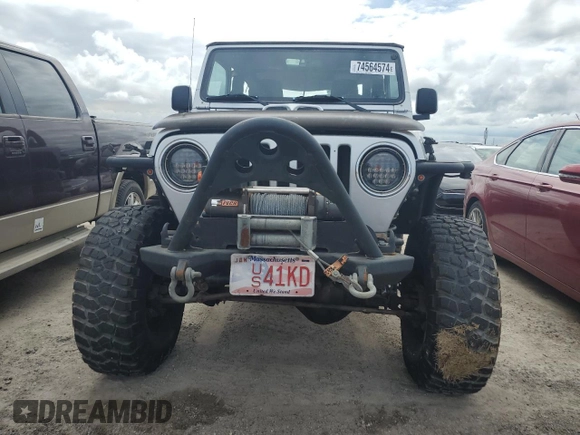 2003 Jeep Wrangler Rubicon z VIN 1J4FA69S53P340085, wystawiony jako Copart lot #74564574 z przebiegiem Nie podano mil oraz Szkoda całkowita • Salvage title. Historia ofert i sprzedaży dostępna na DreamBid. Obrazek 5.