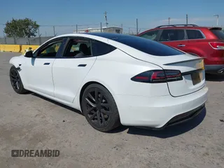 2023 Tesla Model S with VIN 5YJSA1E59PF500816, listed as a IAAI auction lot 42409049 with Not provided miles and . Bid and sale history available at DreamBid. Image 3.