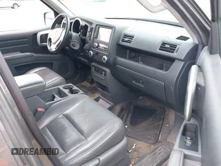 2007 Honda Ridgeline RTL z VIN 2HJYK16517H511157, wystawiony jako IAAI lot #42257637 z przebiegiem 266 894 mil mil oraz . Historia ofert i sprzedaży dostępna na DreamBid. Obrazek 5.