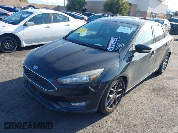 2015 Ford Focus SE with VIN 1FADP3F22FL306055, listed as a IAAI auction lot 41966475 with 139,228 mi miles. Bid and sale history available at carsss.com. Image 2.