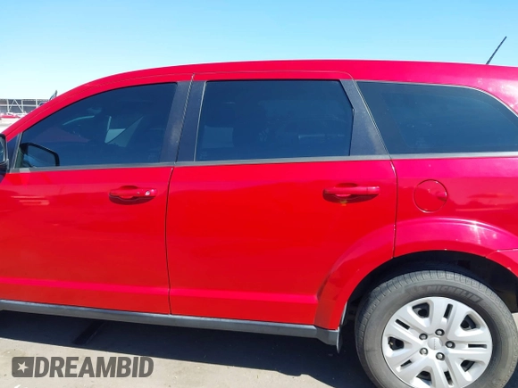 2015 Dodge Journey SE z VIN 3C4PDCAB9FT587668, wystawiony jako IAAI lot #41868556 z przebiegiem 99 695 mil mil oraz . Historia ofert i sprzedaży dostępna na DreamBid. Obrazek 14.