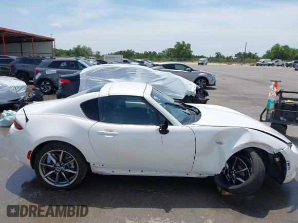 2023 Mazda MX-5 Miata Grand Touring с VIN JM1NDAM71P0560062, выставлен на аукционе IAAI как лот 42065123 с пробегом 11 320 миль миль и . История ставок и продаж доступна на DreamBid. Изображение 18.