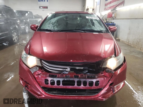 2010 Honda Insight LX with VIN JHMZE2H52AS034613, listed as a Copart auction lot 52701795 with 232,541 mi miles and Salvage Title. Bid and sale history available at DreamBid. Image 5.
