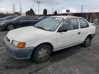 1996 Toyota Tercel DX z VIN JT2AC52L9T0189356, wystawiony jako Copart lot #75311564 z przebiegiem 155 248 mil mil oraz Szkody całkowita. Historia ofert i sprzedaży dostępna na DreamBid. Obrazek 1.