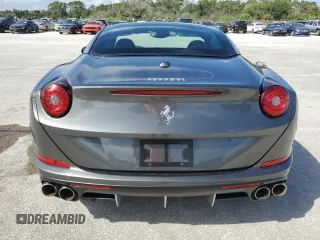 2015 Ferrari California T z VIN ZFF77XJA3F0206563, wystawiony jako Copart lot #73751534 z przebiegiem Nie podano mil oraz Szkody całkowita. Historia ofert i sprzedaży dostępna na DreamBid. Obrazek 6.