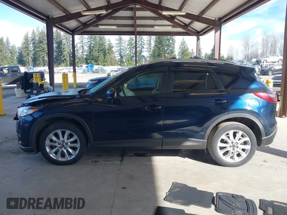 2014 Mazda CX-5 Grand Touring with VIN JM3KE2DY6E0394172, listed as a IAAI auction lot 41698468 with 89,554 mi miles. Bid and sale history available at carsss.com. Image 14.
