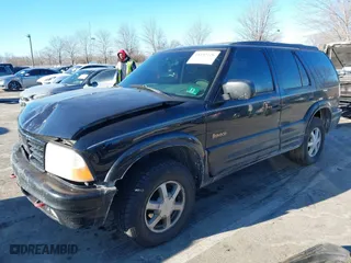 2001 Oldsmobile Bravada with VIN 1GHDT13W312117182, listed as a IAAI auction lot 41457726 with 160,288 mi miles. Bid and sale history available at carsss.com. Image 2.