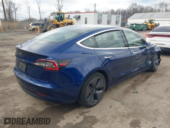 2019 Tesla Model 3 Mid Range with VIN 5YJ3E1EA5KF299589, listed as a IAAI auction lot 41709733 with 50,256 mi miles and . Bid and sale history available at DreamBid. Image 4.