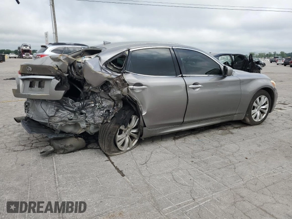 2013 Infiniti M with VIN JN1BY1AR2DM601965, listed as a Copart auction lot 62014215 with 134,047 mi miles and Salvage title. Bid and sale history available at DreamBid. Image 3.