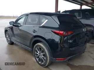 2021 Mazda CX-5 Signature with VIN JM3KFBEY5M0432033, listed as a IAAI auction lot 41607215 with 49,870 mi miles. Bid and sale history available at carsss.com. Image 3.