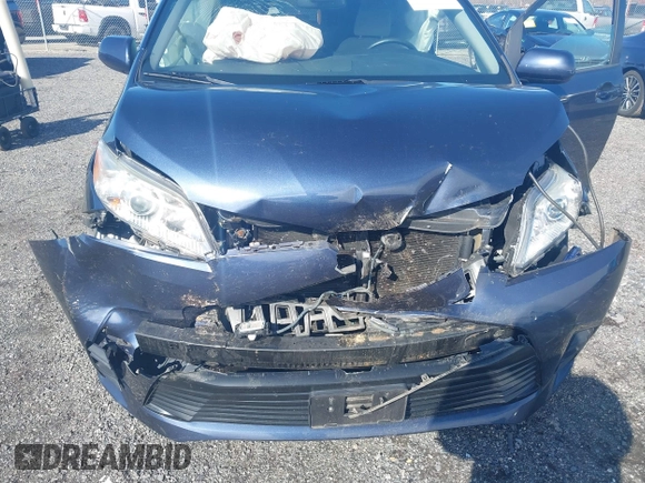 2018 Toyota Sienna LE with VIN 5TDJZ3DC4JS189041, listed as a IAAI auction lot 41610754 with 61,862 mi miles and . Bid and sale history available at DreamBid. Image 6.