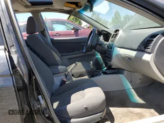 2005 Kia Spectra LX with VIN KNAFE121255156796, listed as a Copart auction lot 58595684 with 197,792 mi miles and Salvage Title. Bid and sale history available at carsss.com. Image 7.