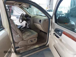 2004 GMC Envoy SLE with VIN 1GKDT13S442136464, listed as a IAAI auction lot 41874304 with 250,330 mi miles. Bid and sale history available at carsss.com. Image 5.