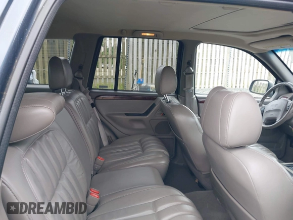 2000 Jeep Grand Cherokee Limited with VIN 1J4GW58N1YC395806, listed as a IAAI auction lot 42267747 with 180,120 mi miles and . Bid and sale history available at DreamBid. Image 8.