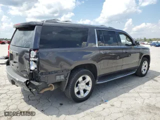 2015 Chevrolet Suburban LTZ with VIN 1GNSCKKCXFR216890, listed as a Copart auction lot 52695155 with 233,296 mi miles and Clean Title. Bid and sale history available at carsss.com. Image 3.