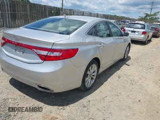 2014 Hyundai Azera Limited z VIN KMHFH4JG9EA397338, wystawiony jako IAAI lot #42352208 z przebiegiem 90 253 mil mil oraz . Historia ofert i sprzedaży dostępna na DreamBid. Obrazek 4.