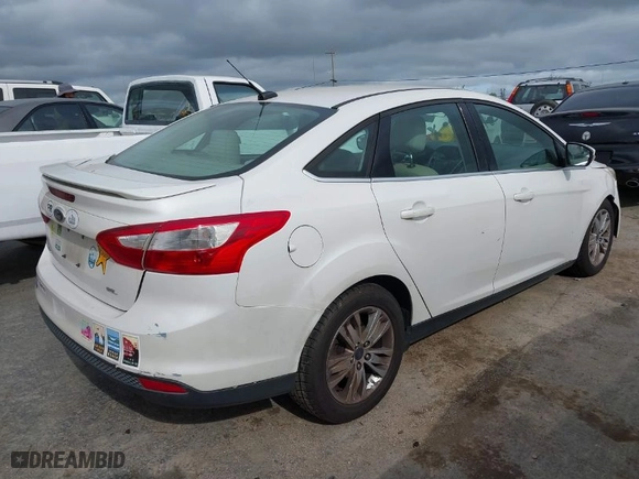 2012 Ford Focus SEL with VIN 1FAHP3H27CL387869, listed as a IAAI auction lot 41976528 with 106,927 mi miles. Bid and sale history available at carsss.com. Image 4.