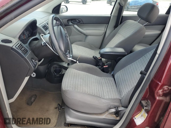 2006 Ford Focus S z VIN 1FAFP34N36W171785, wystawiony jako Copart lot #55815195 z przebiegiem 164 074 mil mil oraz Szkoda całkowita • Salvage title. Historia ofert i sprzedaży dostępna na DreamBid. Obrazek 7.