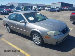 2000 Nissan Maxima GXE z VIN JN1CA31D8YT551822, wystawiony jako IAAI lot #41845010 z przebiegiem 297 479 mil mil oraz . Historia ofert i sprzedaży dostępna na DreamBid. Obrazek 1.