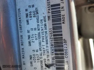 2011 Mazda Mazda3 s Sport with VIN JM1BL1K65B1424651, listed as a Copart auction lot 50227895 with 193,858 mi miles and Salvage Title. Bid and sale history available at carsss.com. Image 12.