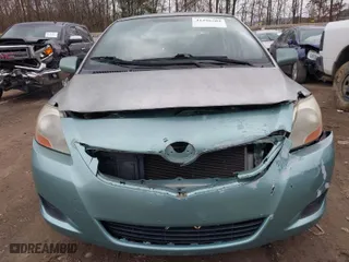 2009 Toyota Yaris with VIN JTDBT903591344333, listed as a IAAI auction lot 41296702 with 166,979 mi miles. Bid and sale history available at carsss.com. Image 6.